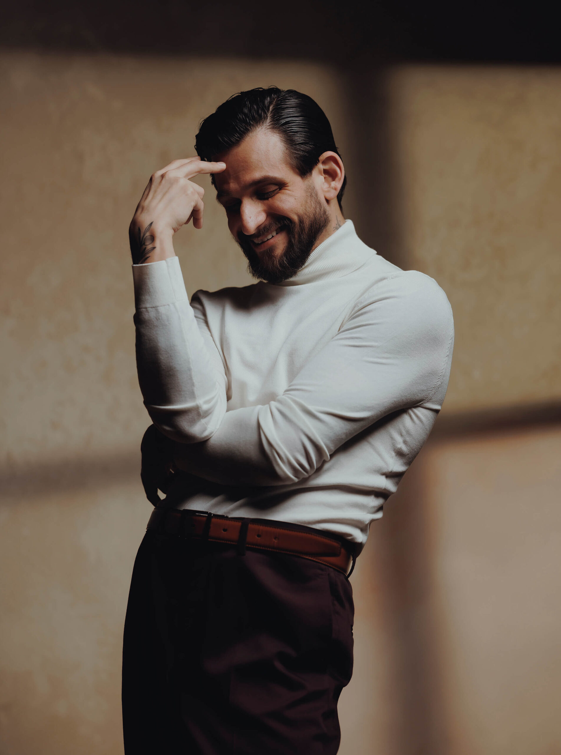 Richard Cortez smiling while wearing a turtleneck